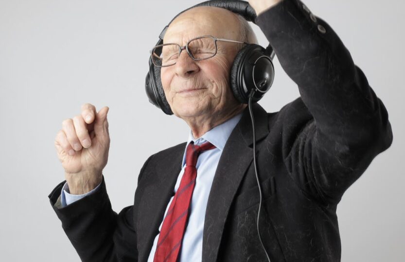 man in black jacket wearing black headphones